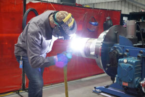 A welder fabricates reactor components at the Kairos Power Manufacturing Development Campus