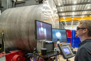 A welder fabricates reactor components at the Kairos Power Manufacturing Development Campus